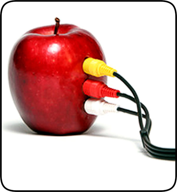An apple with speaker electronic connections attached